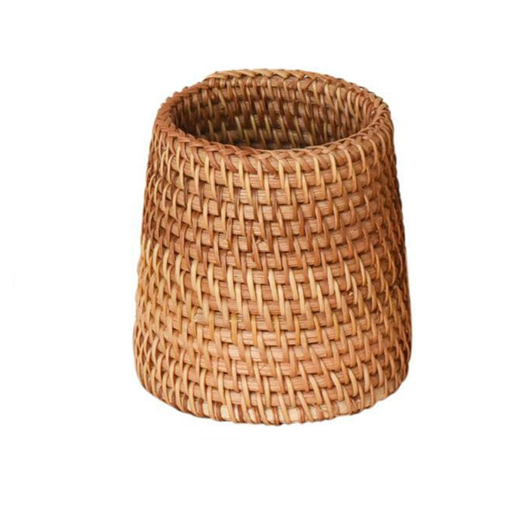 Round honey rattan cups holding wooden utensils