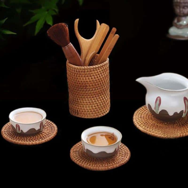 Round honey rattan cups holding wooden utensils