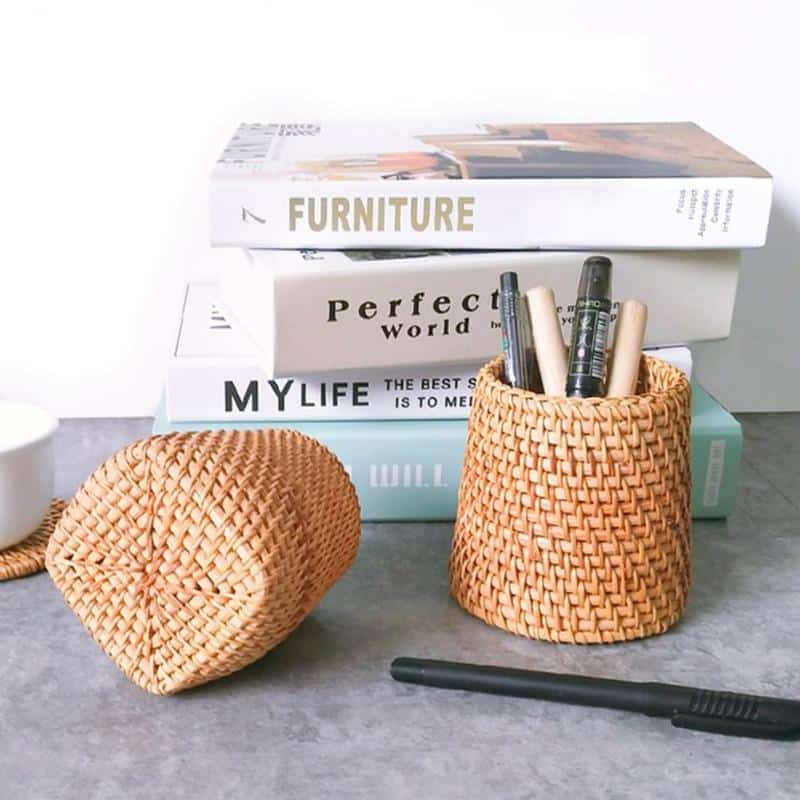 Round honey rattan cups holding wooden utensils