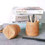 Round honey rattan cups holding wooden utensils