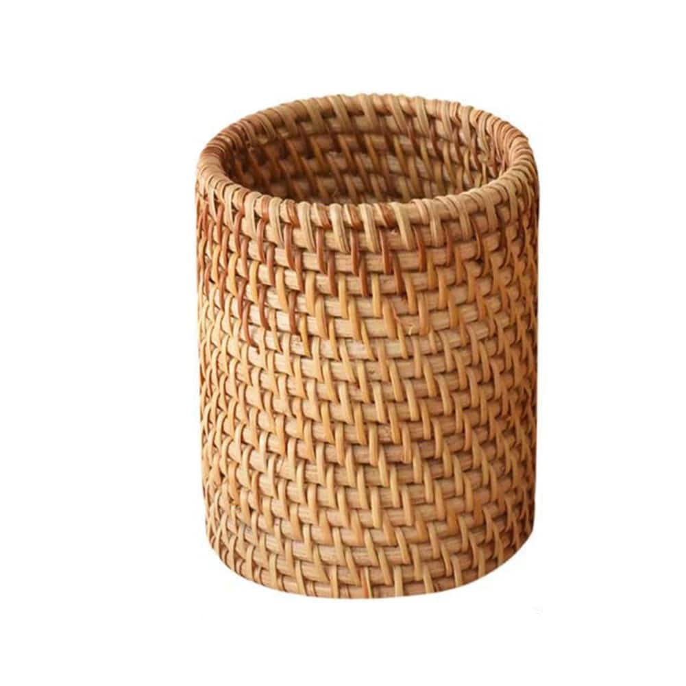 Round honey rattan cups holding wooden utensils
