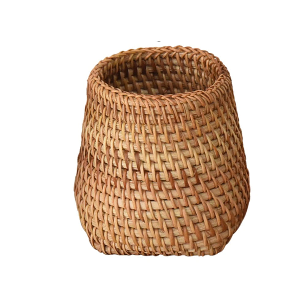 Round honey rattan cups holding wooden utensils