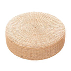 Round low rattan floor pouf hand woven in a spiral