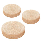 Round low rattan floor pouf hand woven in a spiral