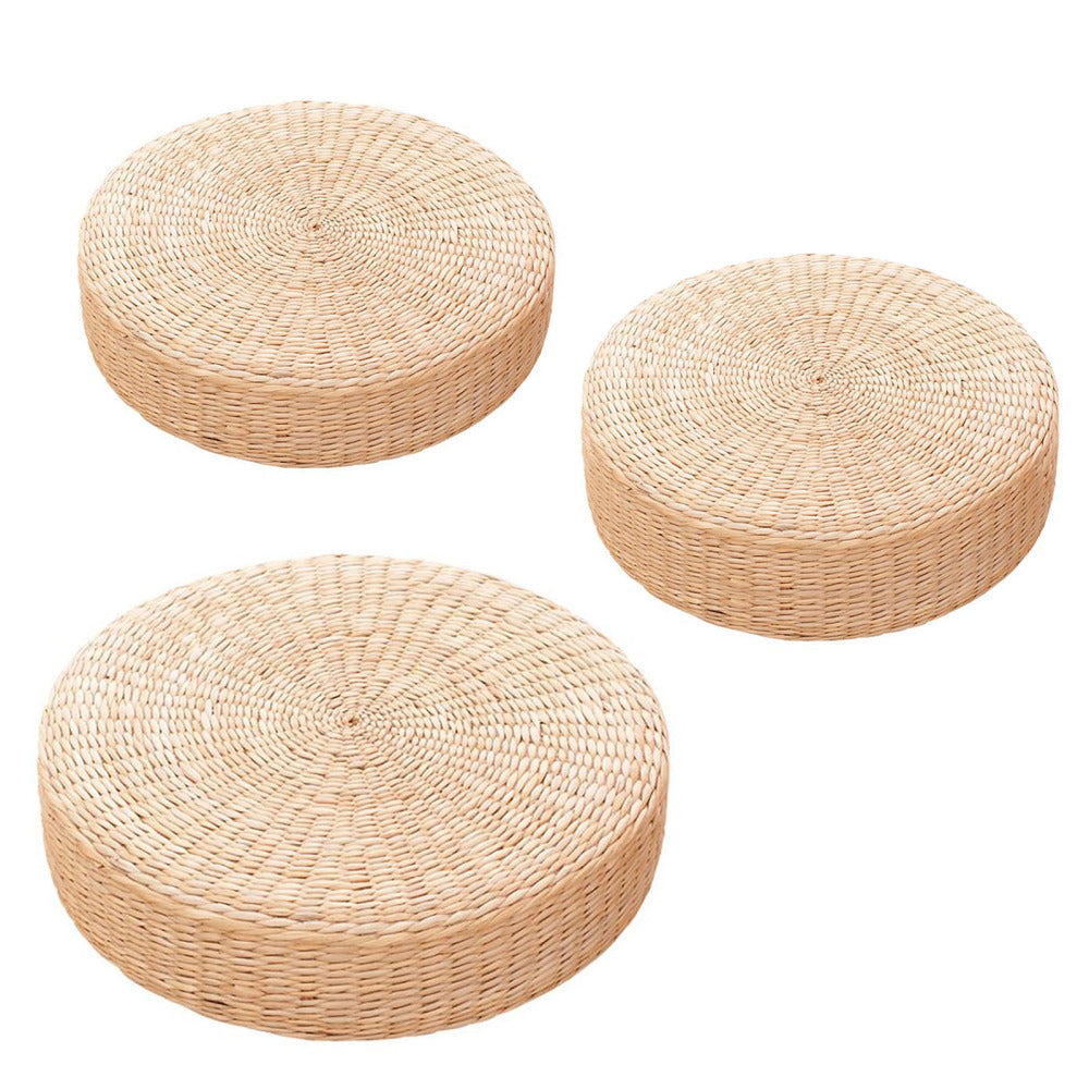 Round low rattan floor pouf hand woven in a spiral