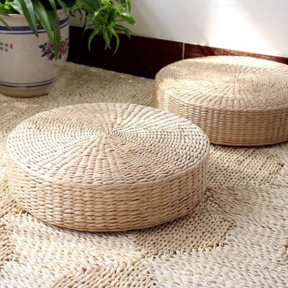 Round low rattan floor pouf hand woven in a spiral