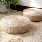 Round low rattan floor pouf hand woven in a spiral