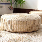 Round low rattan floor pouf hand woven in a spiral