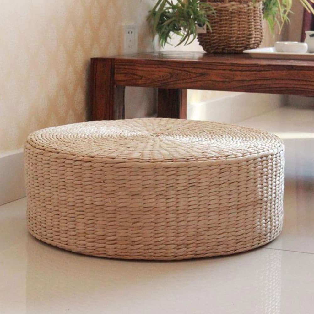 Round low rattan floor pouf hand woven in a spiral