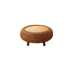 Low round coffee table hand woven in brown wicker on rattan legs