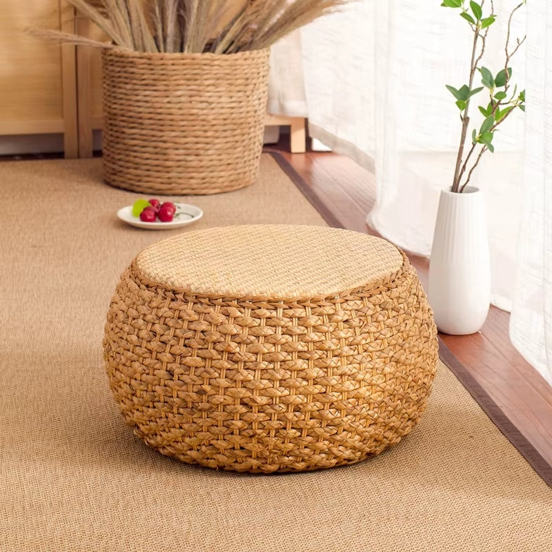 Round hand woven wicker pouf stool with a tight weave