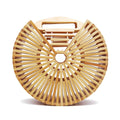 Round handbag pairing smooth sanded wood with a hand woven rattan body