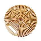 Round handbag pairing smooth sanded wood with a hand woven rattan body