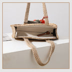 Round hand woven crossbody bag with a textured weave and hand knotted pompoms