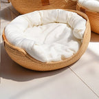 Round woven pet bed with plush removable cushions