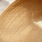 Round woven pet bed with plush removable cushions