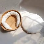 Round woven pet bed with plush removable cushions