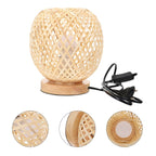 Round bedside lamp with a hand woven rattan shade on a woven base