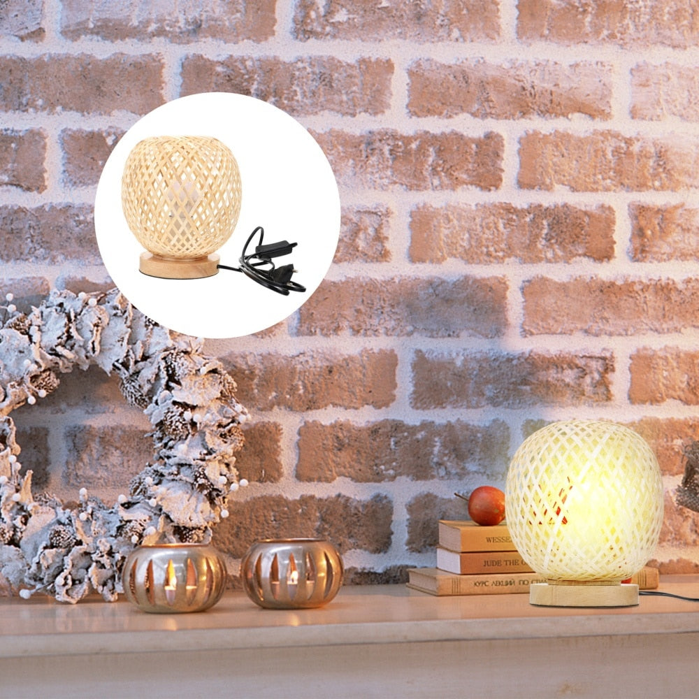 Round bedside lamp with a hand woven rattan shade on a woven base