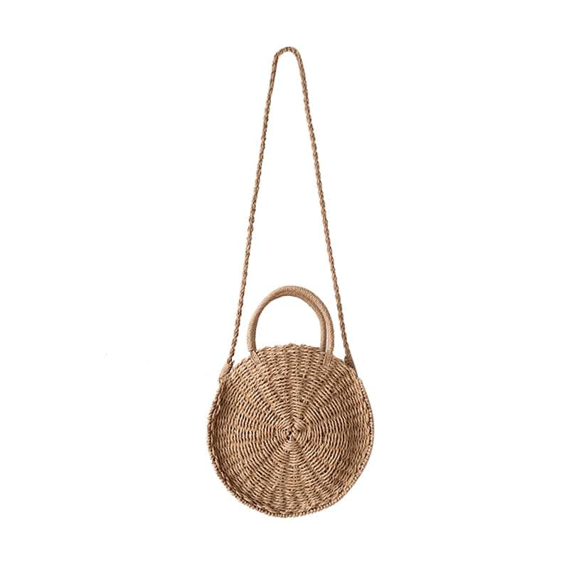 Round hand woven rattan crossbody bag with an adjustable strap in brown or beige