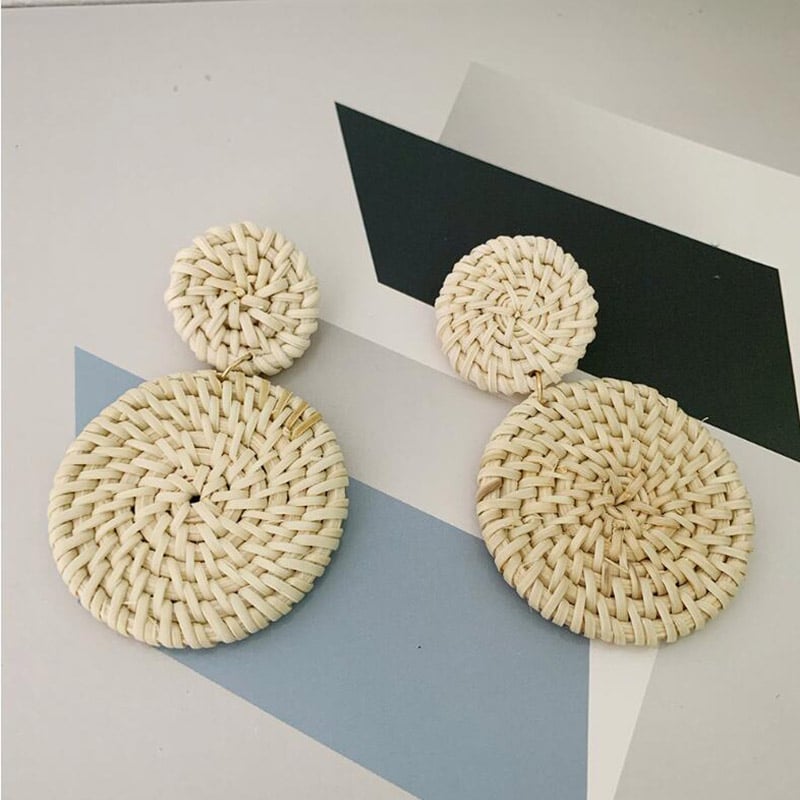 Pair of drop earrings made of two stacked round woven rattan discs