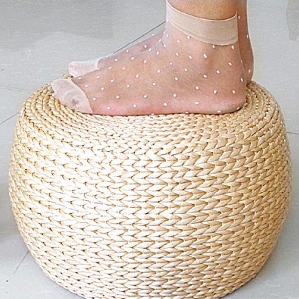 Round domed footstool hand woven in rattan with a chevron pattern