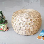 Round domed footstool hand woven in rattan with a chevron pattern