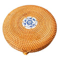 Round hand woven rattan jewelry box with a geometric pattern and lid