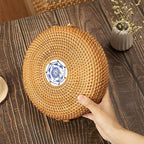 Round hand woven rattan jewelry box with a geometric pattern and lid