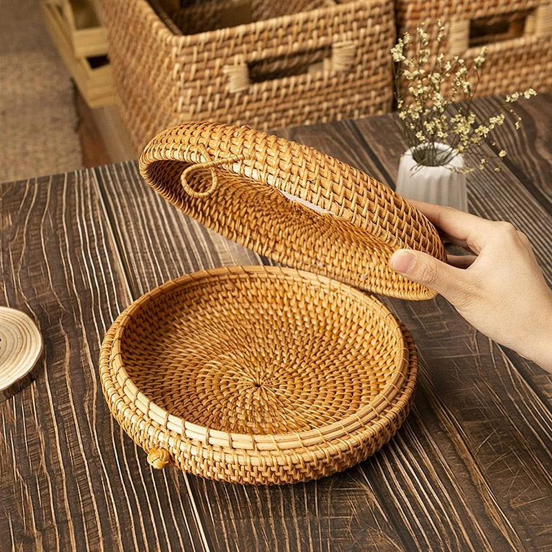 Round hand woven rattan jewelry box with a geometric pattern and lid