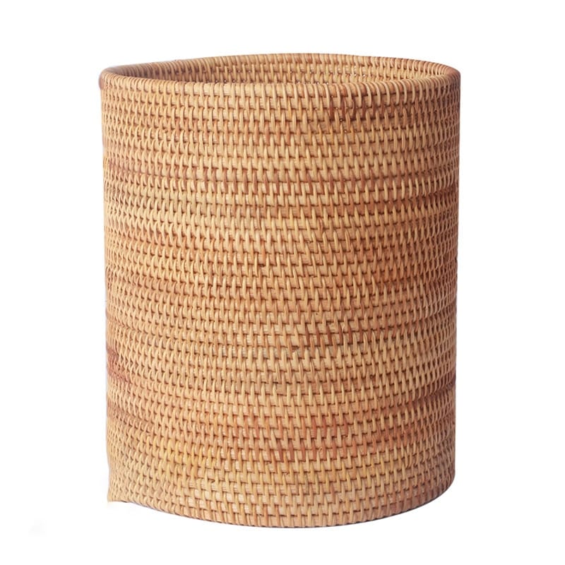 Round straight sided woven rattan bucket holding white flowers