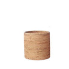 Round straight sided woven rattan bucket holding white flowers