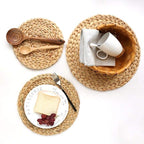 Round hand woven rattan trivets in three sizes on a table