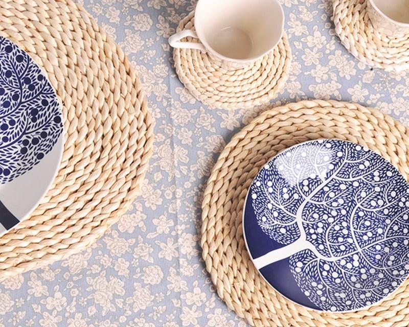 Round hand woven rattan trivets in three sizes on a table