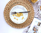 Round hand woven rattan trivets in three sizes on a table