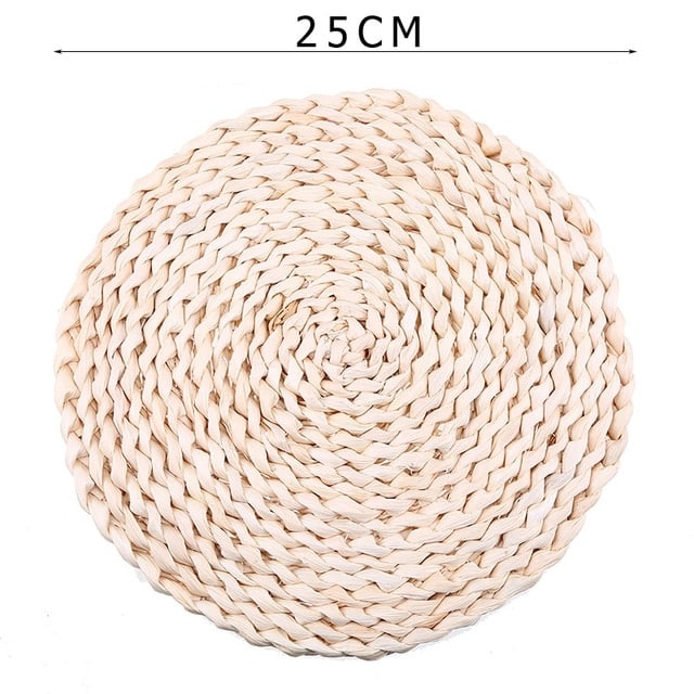 Round hand woven rattan trivets in three sizes on a table
