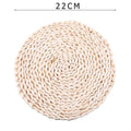 Round hand woven rattan trivets in three sizes on a table