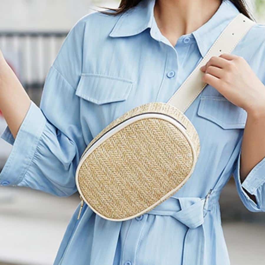 Round woven straw belt bag with an adjustable strap in four colors