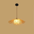 Ruffled flower shaped rattan pendant glowing warm