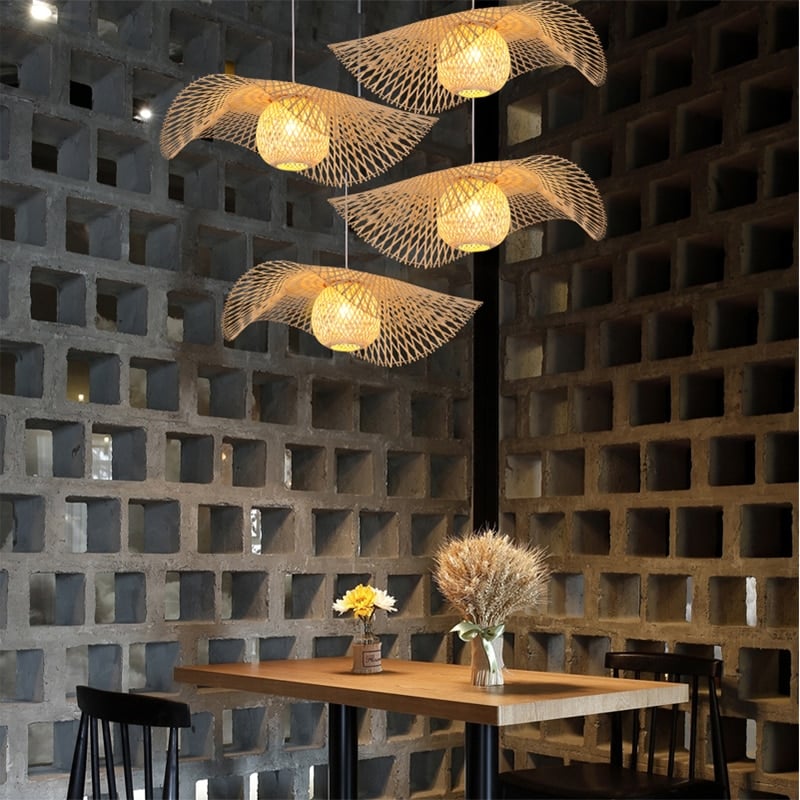 Ruffled flower shaped rattan pendant glowing warm