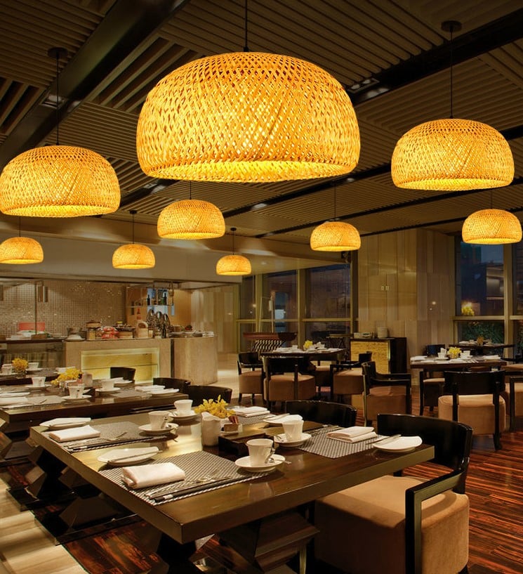 Rustic round pendant light hand woven in natural rattan