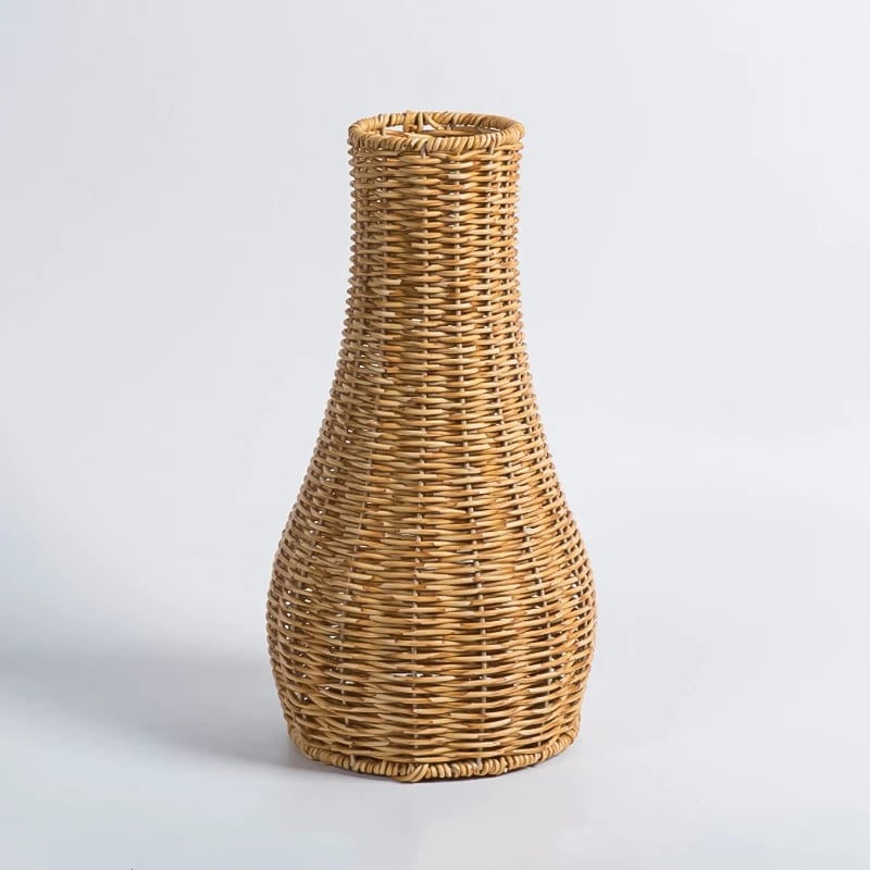 Rustic handwoven wicker vase with a bottle shape