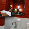 Rustic wood corner wall shelf in a bathroom