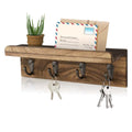 Rustic wood key holder shelf with four hooks holding keys and mail