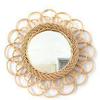 Scalloped rattan petals around a woven ring.