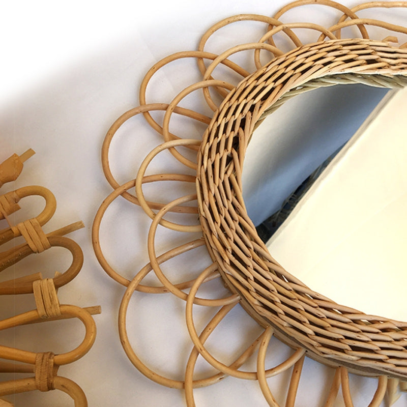 Scalloped rattan petals around a woven ring.