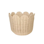 Beige handwoven rattan basket with a scalloped edge