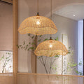 Two scalloped woven bamboo dome pendants at different heights