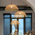 Two scalloped woven bamboo dome pendants at different heights