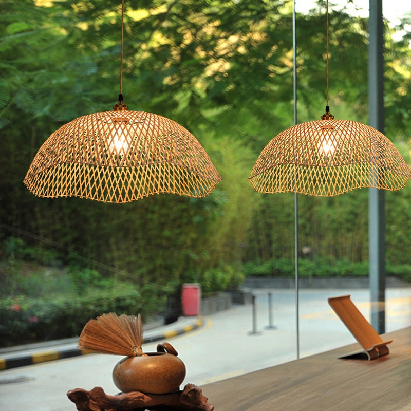 Two scalloped woven bamboo dome pendants at different heights